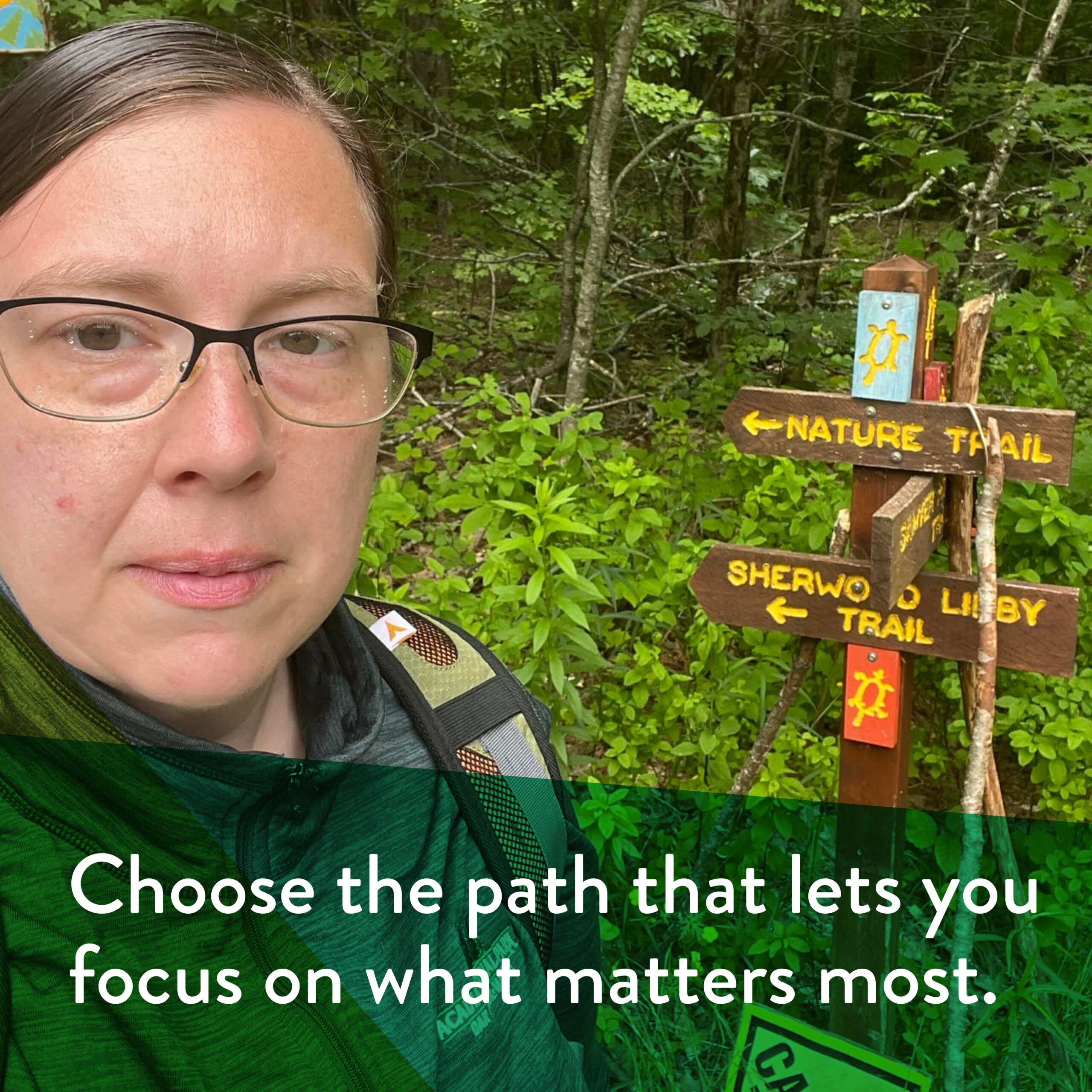 lisa cash selfie with a hiking trail sign