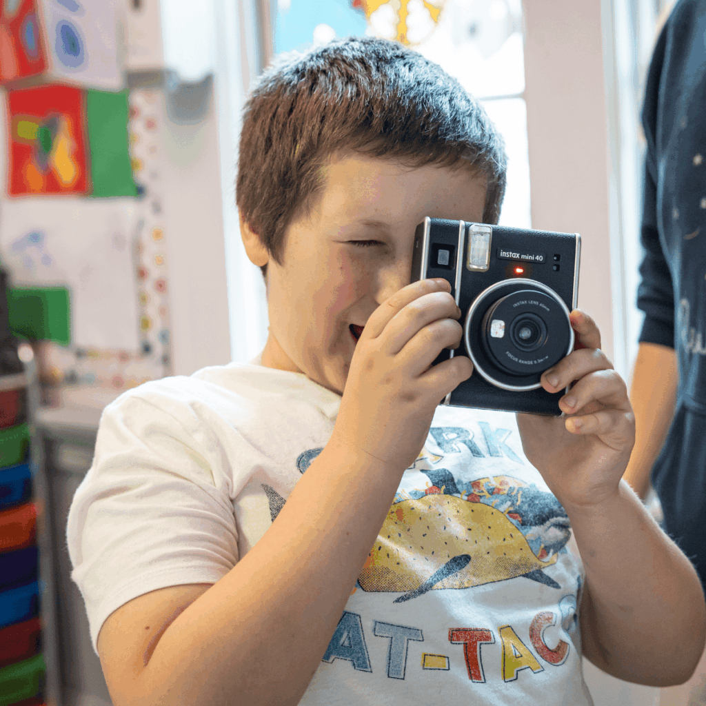 Student holding a camera