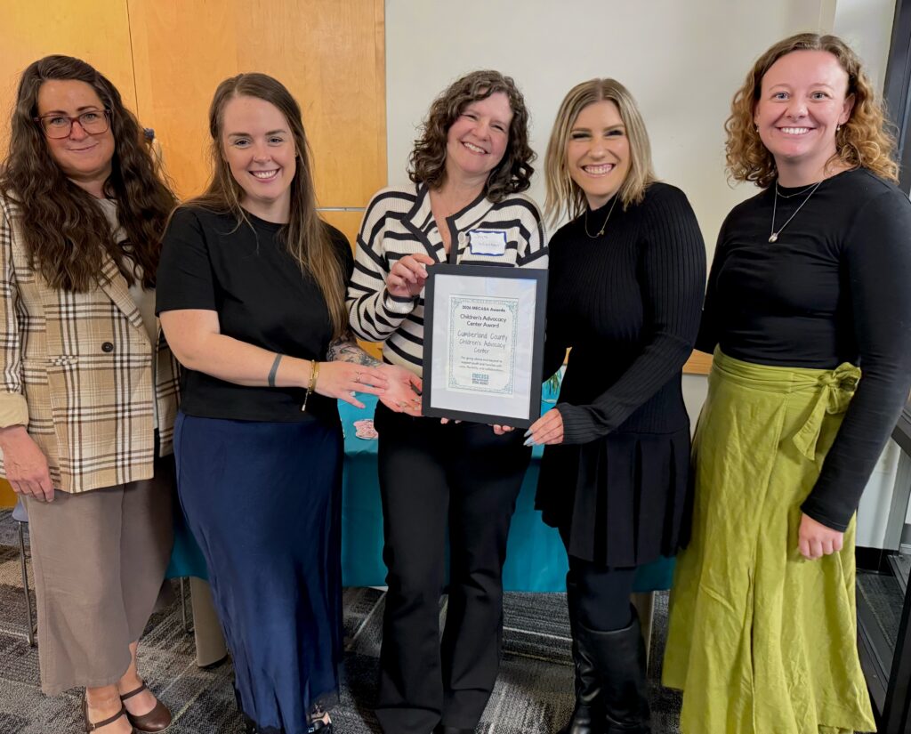 Spurwink Cumberland CAC staff holding their award from MECASA.